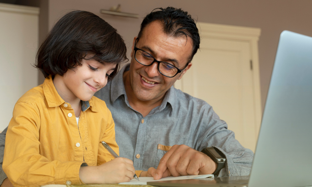 Father helping son build the best study habits for elementary students at home
