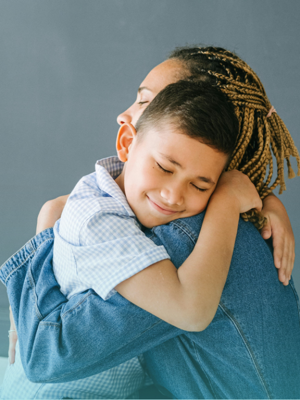Mother and son embracing to nurture emotional health in kids