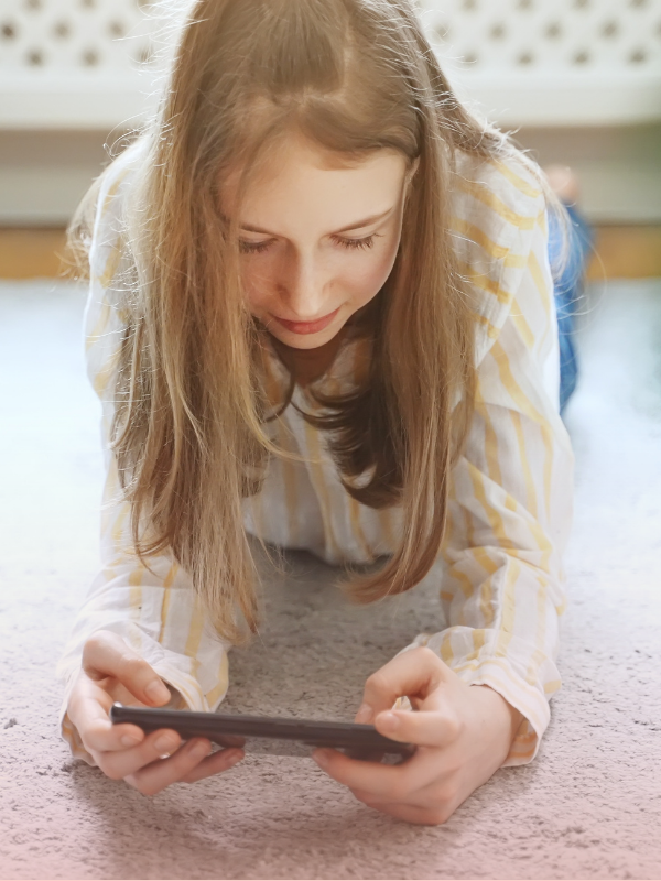 Tween girl learning healthy tech habits at home